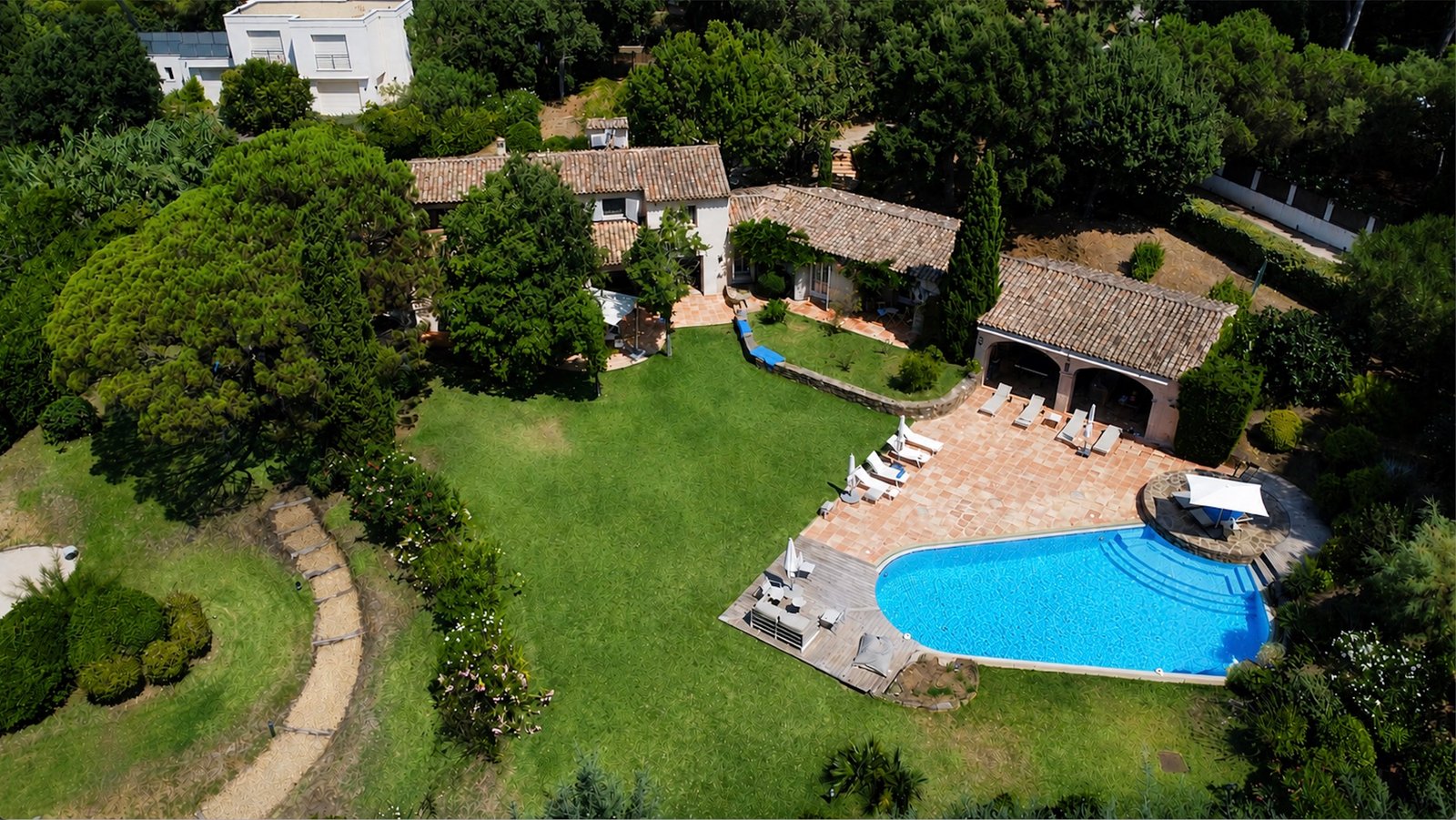 Edited drone photo of a villa and pool, after editing